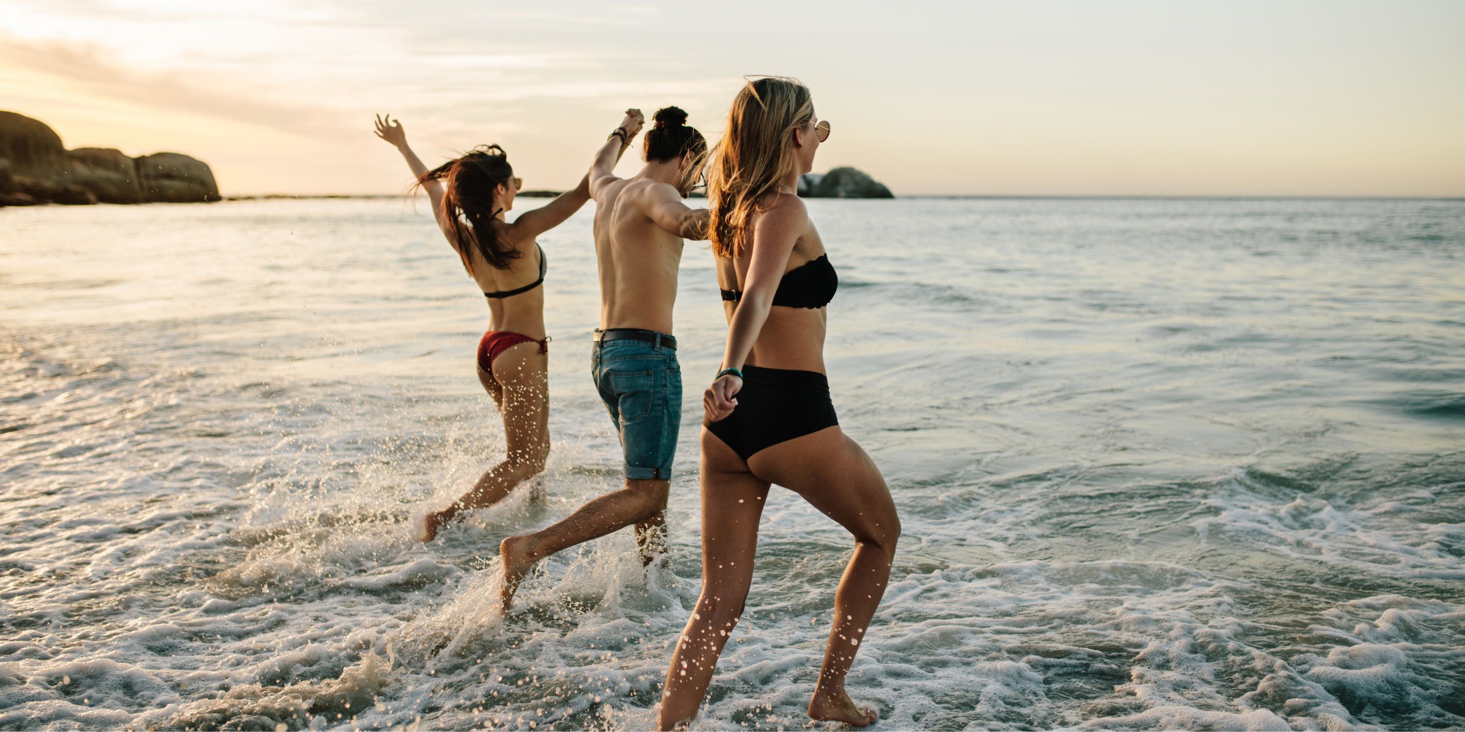 Group travellers on the beach